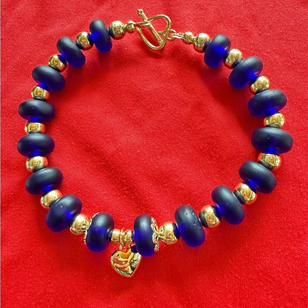 Men’,women’ Lapis lazuli glass beaded bracelet,gold plated spacers.Toggle clasp.